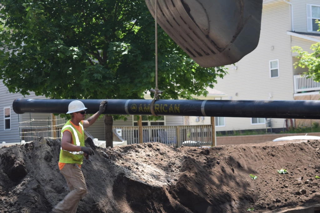 AMERICAN Ductile Iron Pipe with zinc coating being installed by Danner Inc. in Saint Paul, Minnesota.