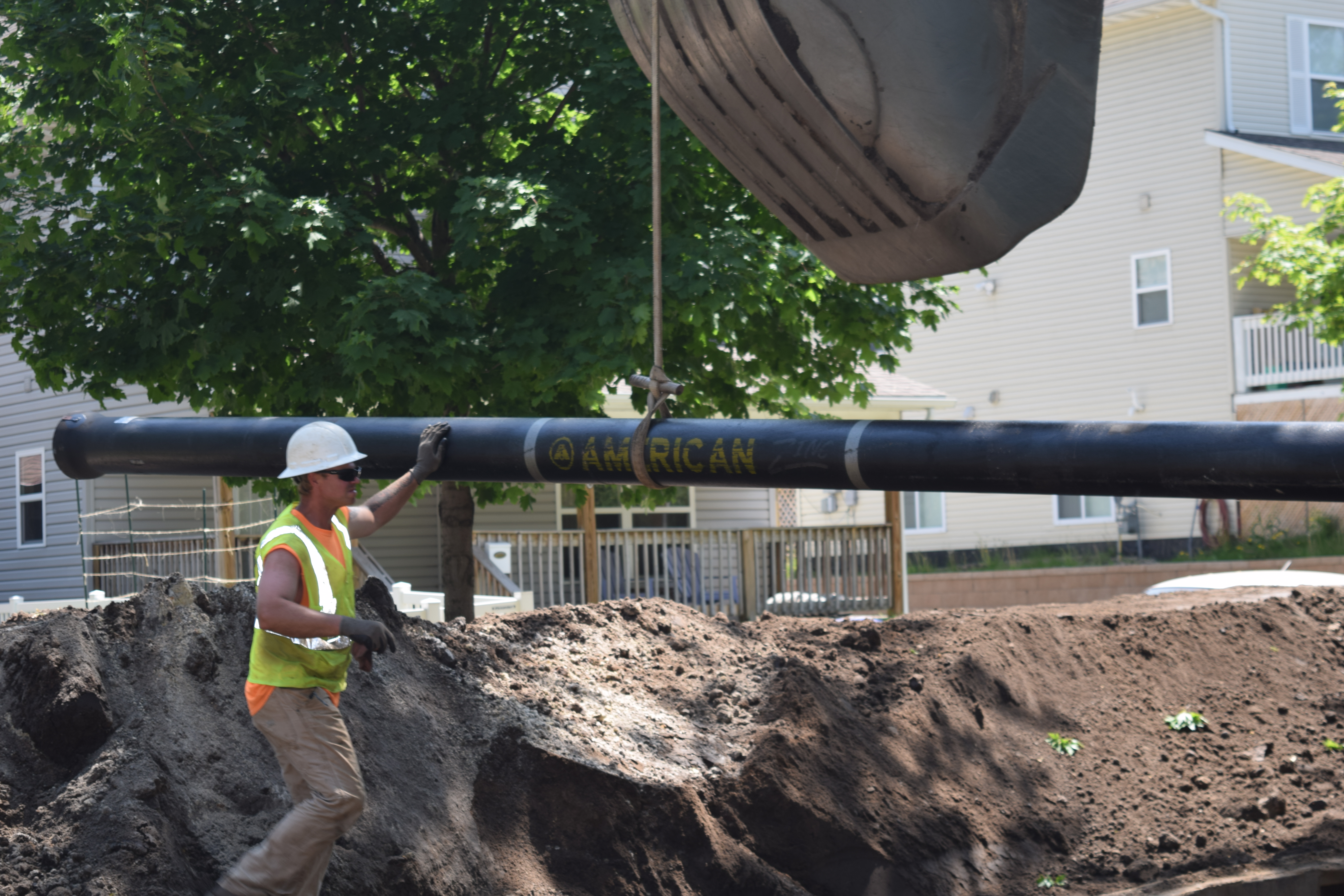 AMERICAN Ductile Iron Pipe with zinc coating being installed by Danner